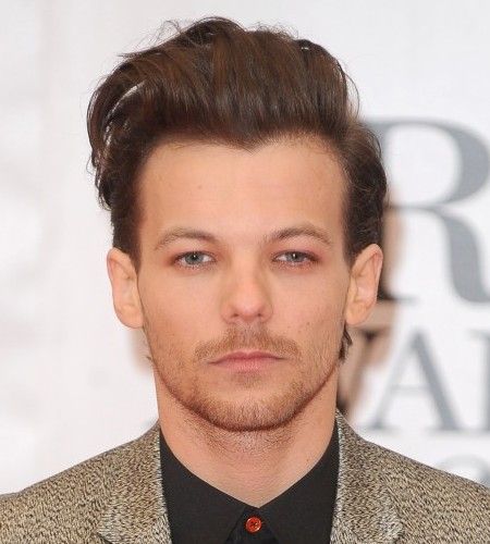 1Dルイ・トムリンソン、彼女のトップレス写真をパパラッチされ怒りのコメント