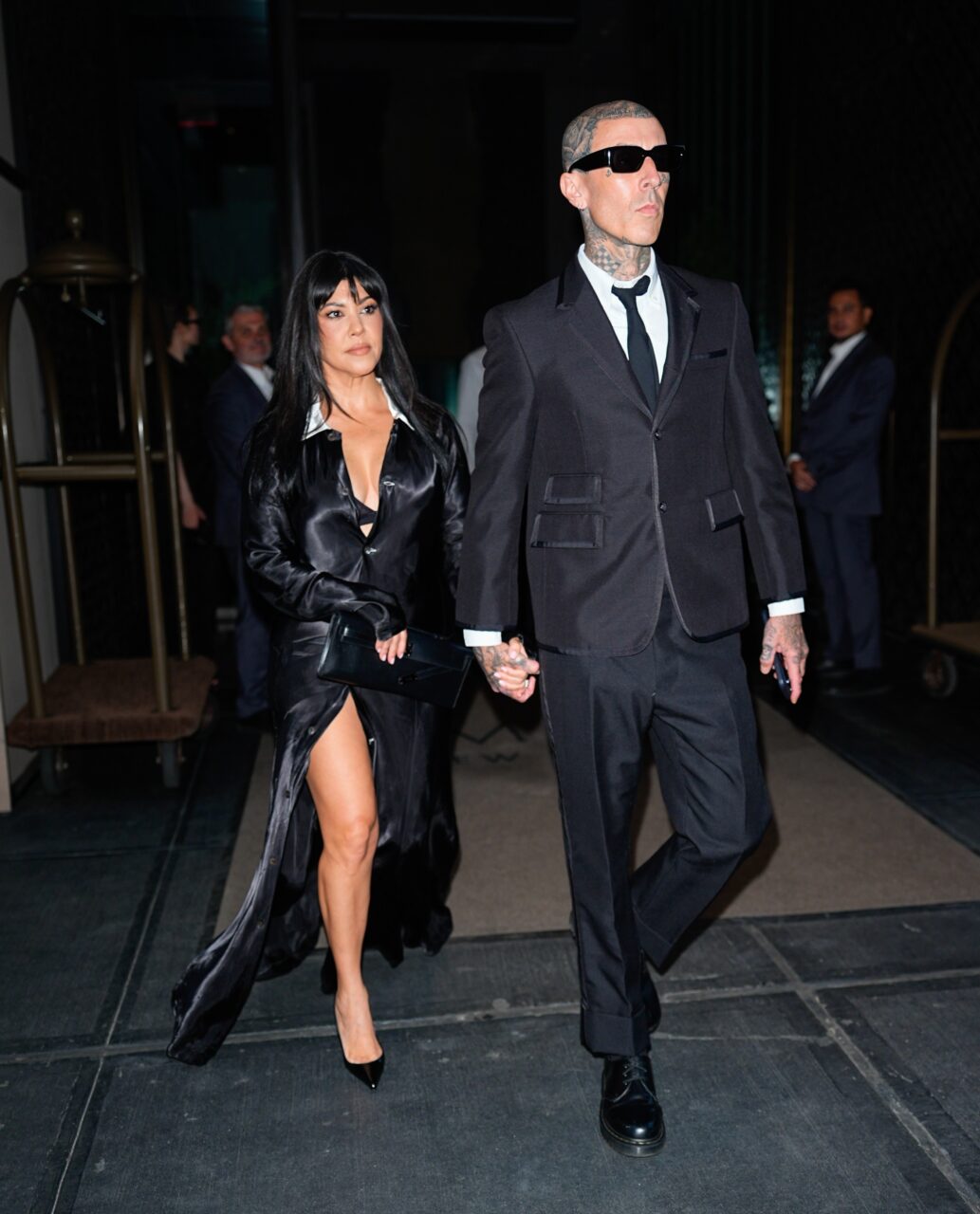 New York, NY Kourtney Kardashian and Travis Barker were spotted departing their hotel in New York City as they headed to the Tribeca Festival. Kourtney wore a long-sleeve black satin maxi dress by Dolce & Gabbana, while Travis opted for a classic black suit. Pictured: Kourtney Kardashian, Travis Barker BACKGRID USA 13 JUNE 2026 BYLINE MUST READ: ASPN / BACKGRID USA: +1 310 798 9111 / usasales@backgrid.com UK: +44 208 344 2007 / uksales@backgrid.com *UK Clients - Pictures Containing Children Please Pixelate Face Prior To Publication*