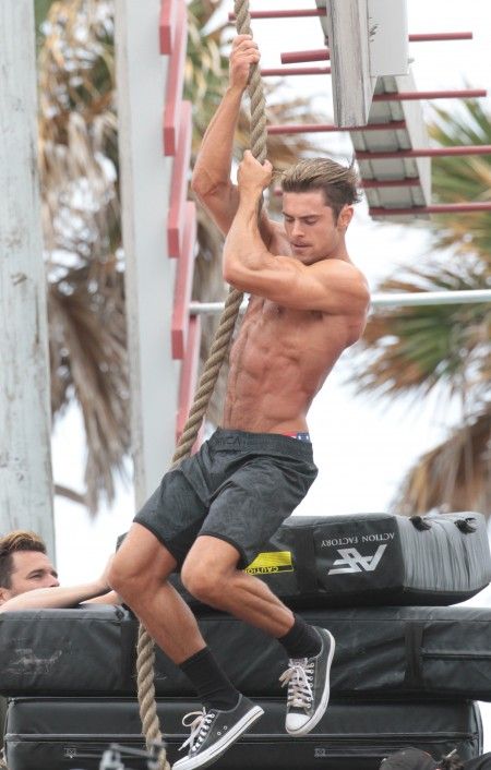 Shirtless Zac Efron on the set of Baywatch in Miami Beach.