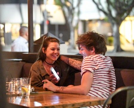 EXCLUSIVE: **PREMIUM EXCLUSIVE RATES APPLY**NO WEB UNTIL 5PM GMT APRIL 22ND**Louis Tomlinson and girlfriend Danielle Campbell enjoy a romantic dinner at The Belmont in West Hollywood, CA