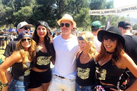 EXCLUSIVE: Brad Pitt poses with a quartet of pretty girls at a vintage motorcycle show in Silverado, California