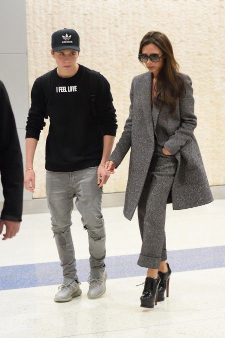 EXCLUSIVE: ***PREMIUM EXCLUSIVE*** Victoria Beckham with her son Brooklyn arrive at JFK airport in NYC.